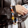 image:imageBaubleBar Phone Charm  Licensed Quality Beaded Phone Charms Colorful and Trendy Accessories for All Ages Universal Fit Great Gift OpportunityWinnie the Pooh